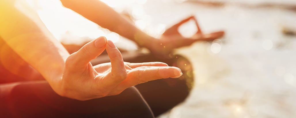 Image of hands in yoga meditation pose.